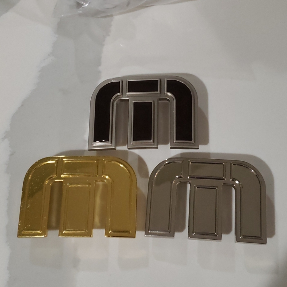 Travis Mathew belt buckles (3)